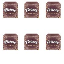 Kleenex Ultra Soft Facial Tissues box on a clean bedside table
