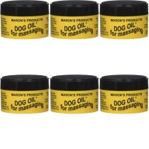 Masons Dog Oil Massaging Balm 100g tub on a wooden surface next to a dog
