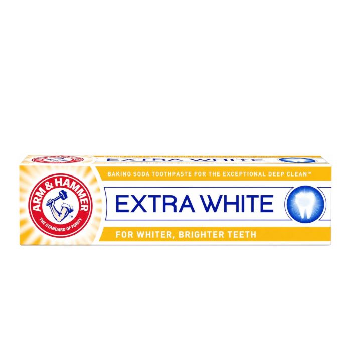 Arm & Hammer Extra White Care Toothpaste 125g tube on a clean bathroom shelf
