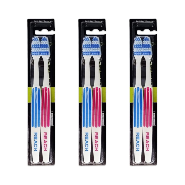 Listerine Duo Reach Interdental Firm Toothbrush Twin Pack on a clean bathroom shelf
